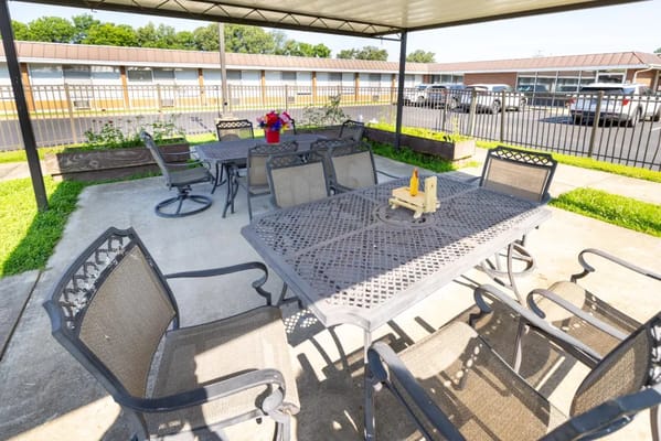 Outdoor seating area with tables and chairs