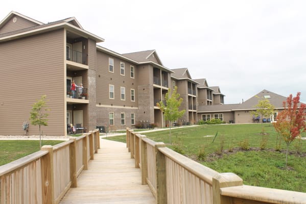 Exterior view of a senior living facility with a pathway