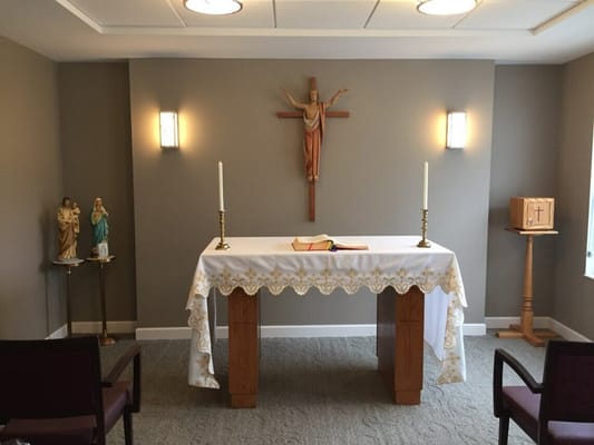 Chapel setting with altar and religious statues