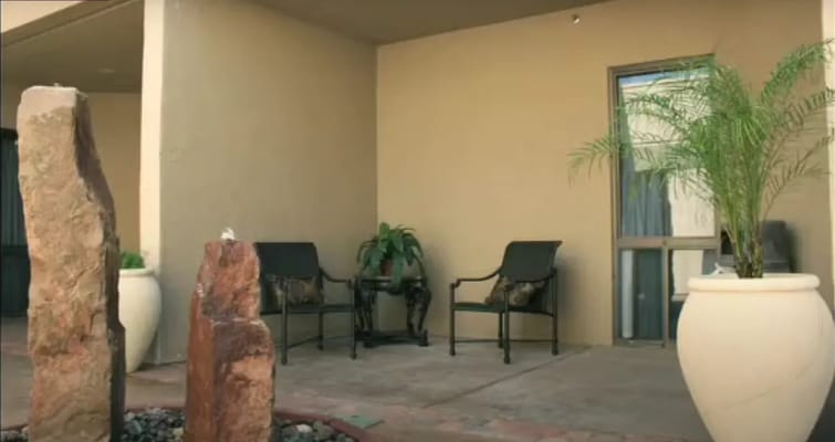 Outdoor patio area with seating and plants
