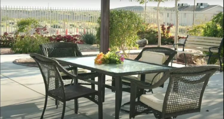 Outdoor seating area with table and chairs