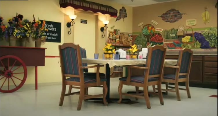 Common area with seating and decorative wall mural