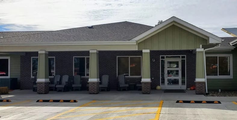 Exterior view of Hansen House Harlan with seating area