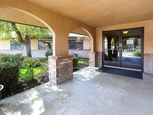 Entrance with arched architecture and garden view