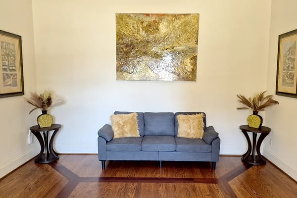 Cozy living area with grey couch and decor