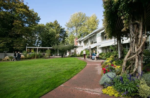 Outdoor area with residents enjoying the garden