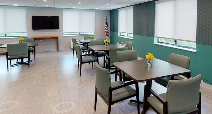 Bright common area with tables and chairs