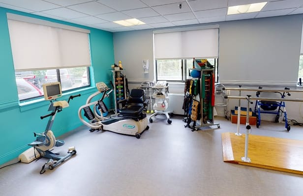 Interior view of a rehabilitation room with therapy equipment