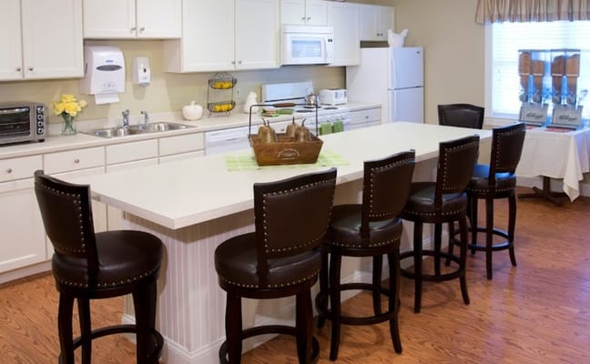 Modern kitchen bar with seating at Armbrook Village