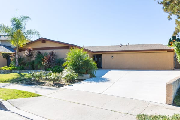 Exterior view of a senior care facility with landscaped gardens