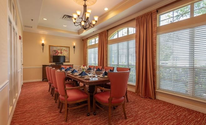 Elegant dining room with a large table set for meals