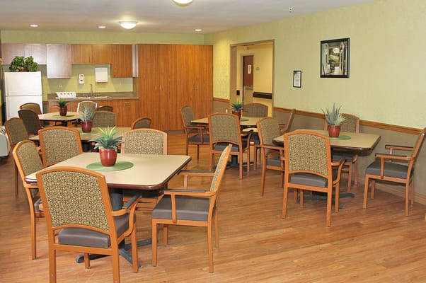 Dining area with tables and chairs in a common area
