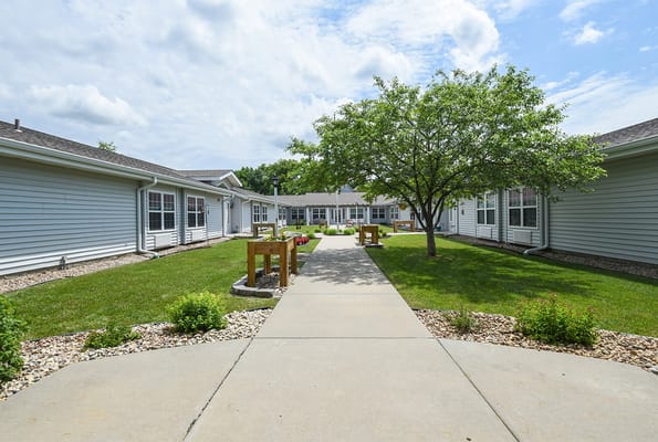 Pathway through a landscaped courtyard at a senior living facility