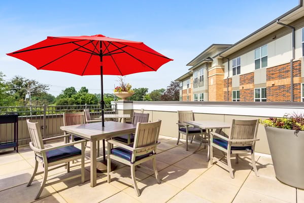 Outdoor seating area with patio furniture and an umbrella
