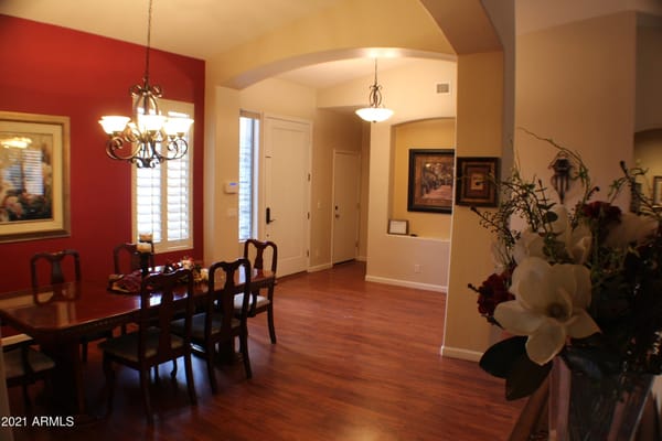 Dining area with wooden table and decorated walls