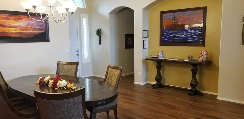 Brightly lit common area with dining table and decor