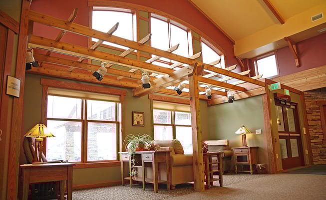 Interior view of a common area with furniture and natural light