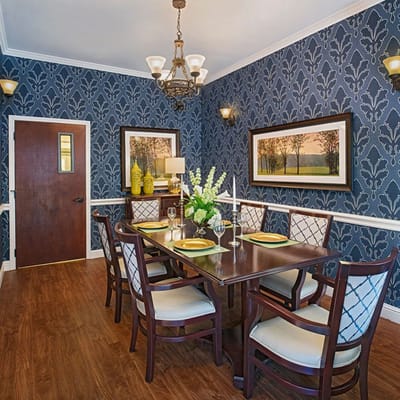 Elegant dining room setup with floral centerpieces