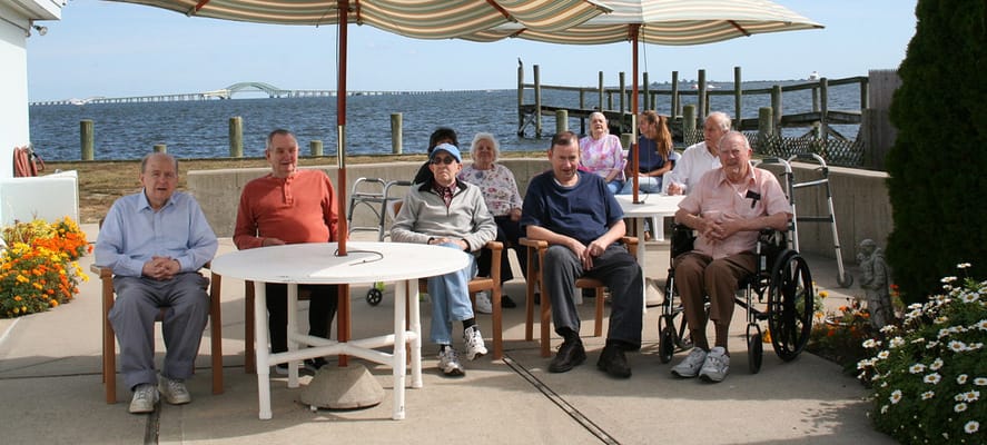 Residents enjoying the outdoor space by the water