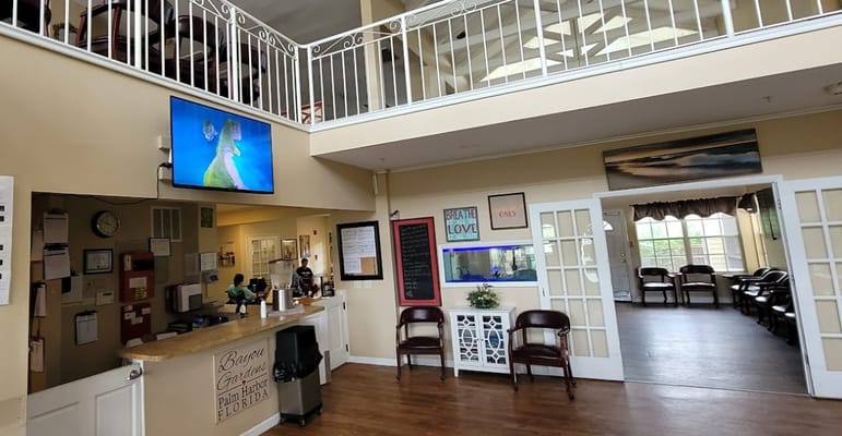 Bright interior of the facility's common area with seating and activities