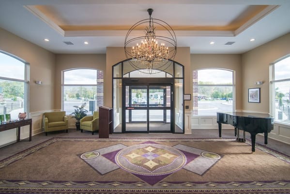 Bright and welcoming lobby area with a grand chandelier