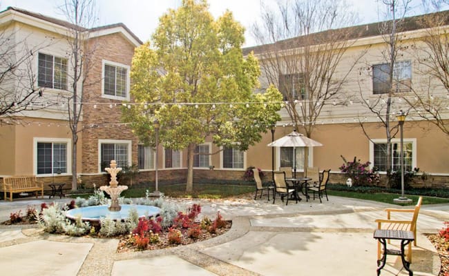 Outdoor courtyard with fountain and seating areas