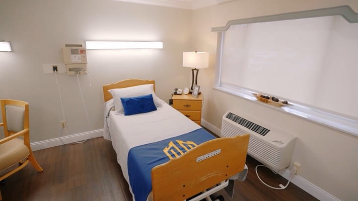 Private resident room with bed and amenities