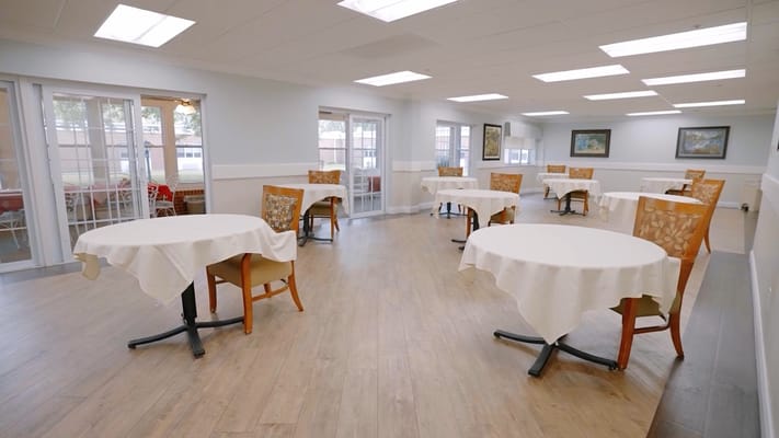 Bright dining room with tables set up