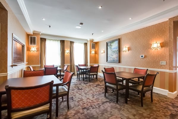 Interior view of a dining area with tables and chairs
