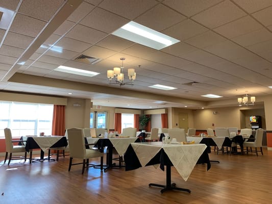 Bright dining room setup with tables and chairs