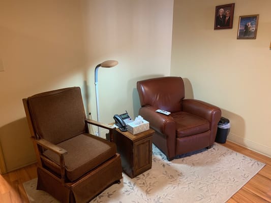 Cozy corner of a facility's living space with chairs and decor
