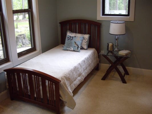 A single bed in a cozy resident room