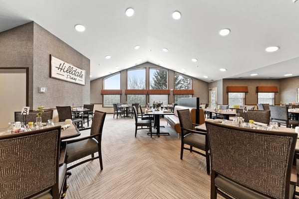 Bright dining area with tables and chairs