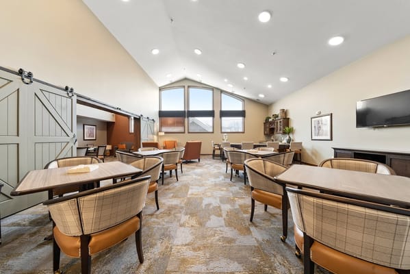 Bright common area with seating and natural light