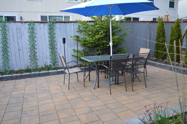 Outdoor patio area with table and chairs