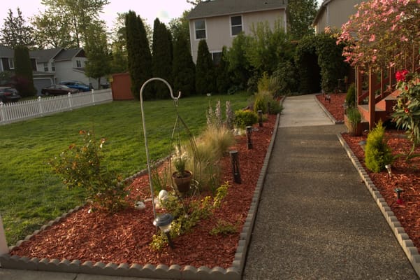 Well-maintained garden path leading to the facility