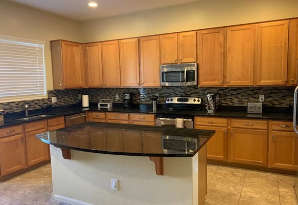 Interior view of a kitchen area with wooden cabinets