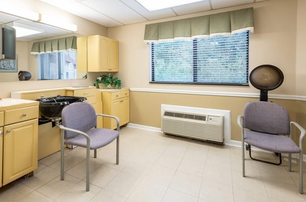 Interior room with kitchen cabinets and chairs