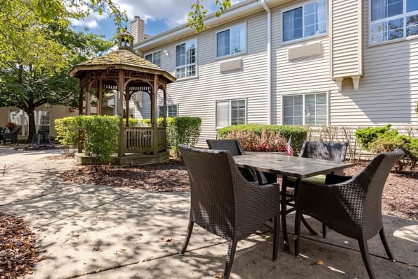 Outdoor patio area with gazebo and seating