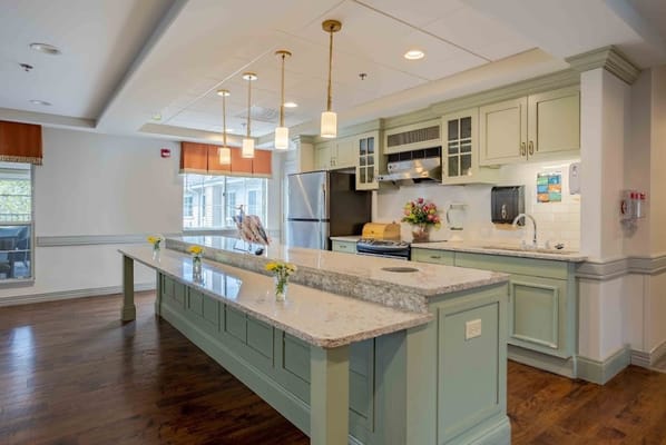Bright, modern kitchen with flowers on the counter