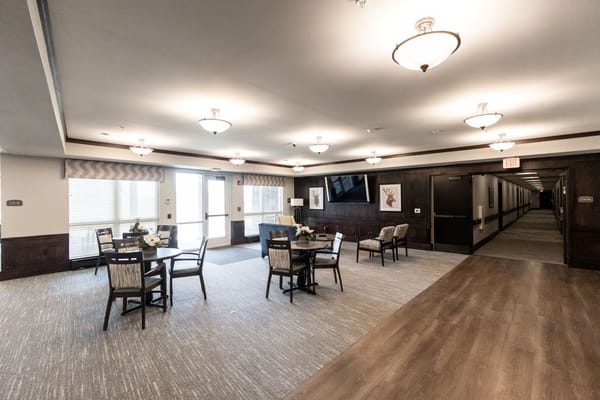 Common area with tables and seating in a facility