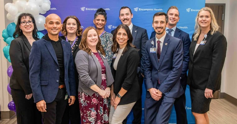 Staff and leadership team members at a celebration event