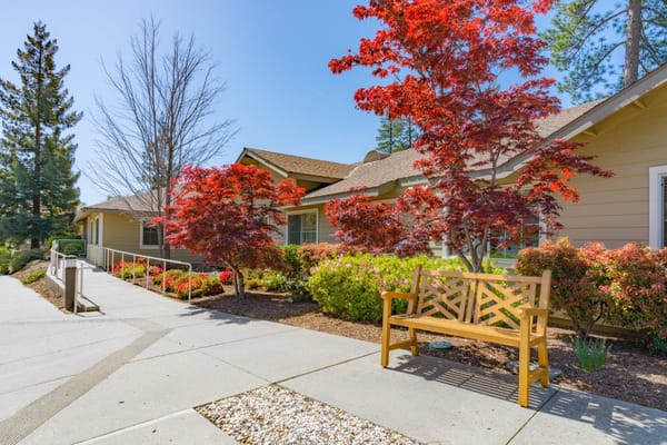 Front entrance of Eskaton Village Grass Valley with colorful trees