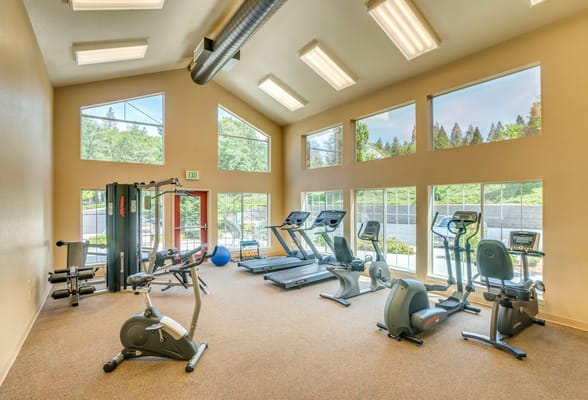 A well-equipped fitness room with exercise equipment