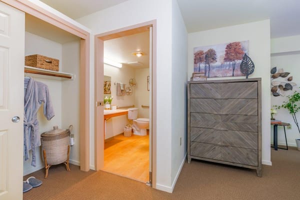 Interior view of a resident bathroom and closet area