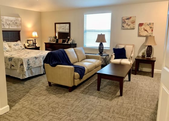 Cozy private room with a bed and seating area