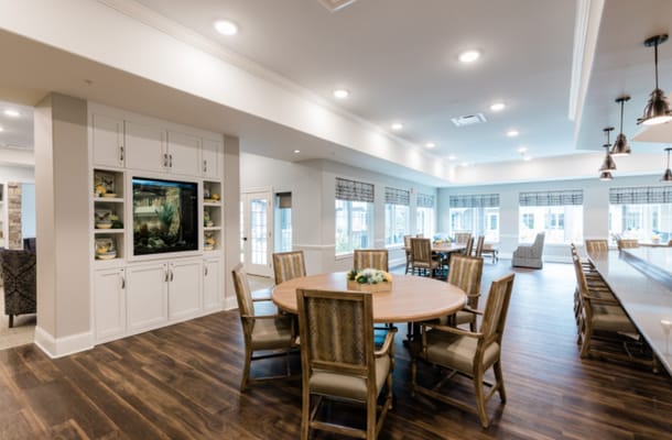 Bright common area with seating and tables