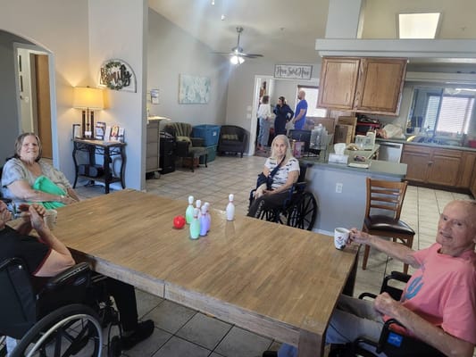 Residents participating in a group activity in the common area