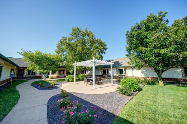 Outdoor courtyard with seating area and landscaping