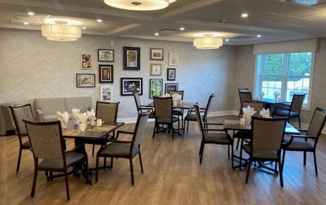 Dining area set up for residents with tables and chairs